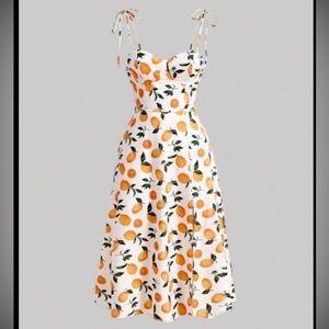 Structured pin up style dress with lemons and oranges